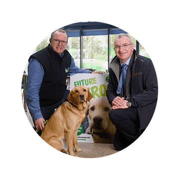 Veterinarians posing with guide dog